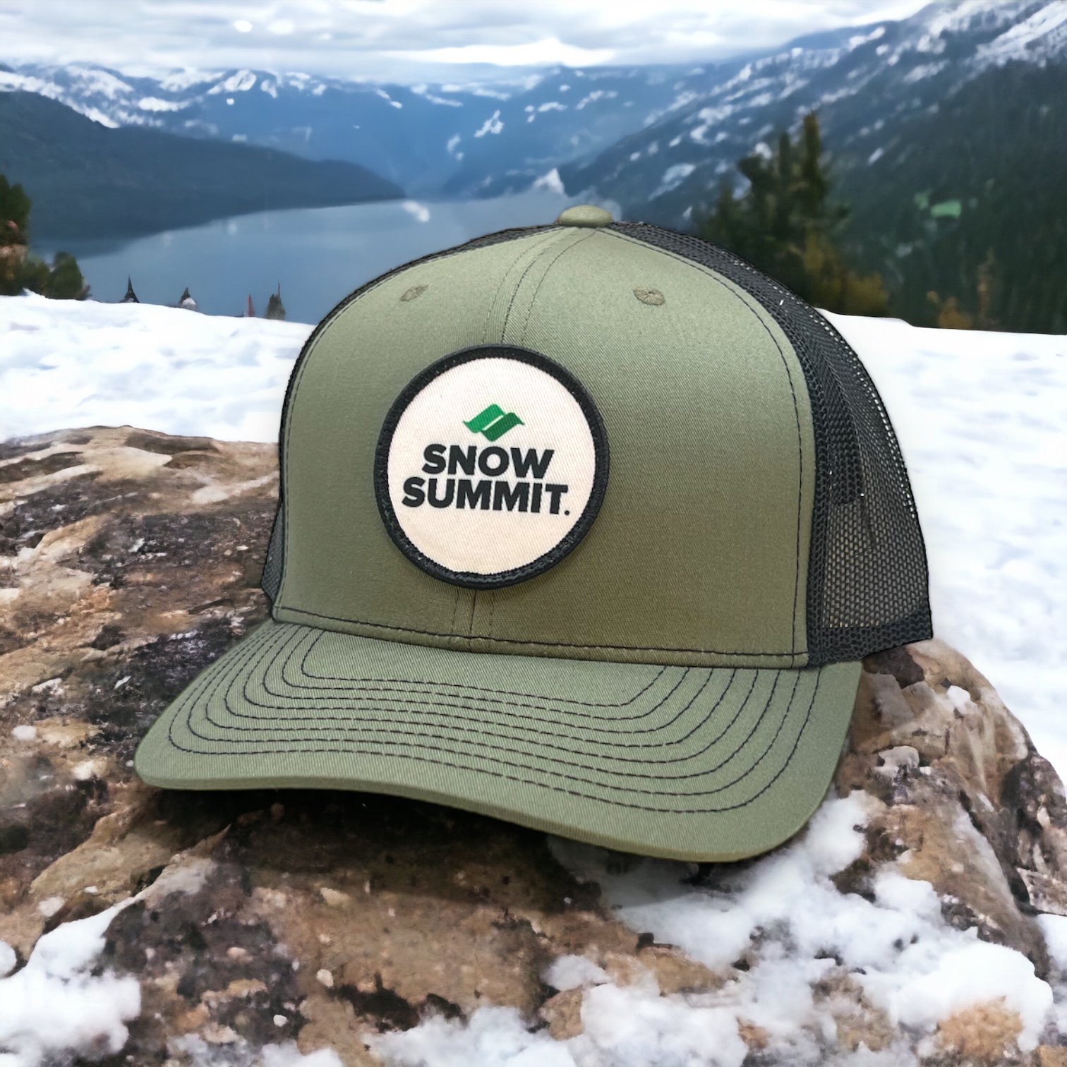 Snow Summit loden green trucker hat with circle logo patch on front